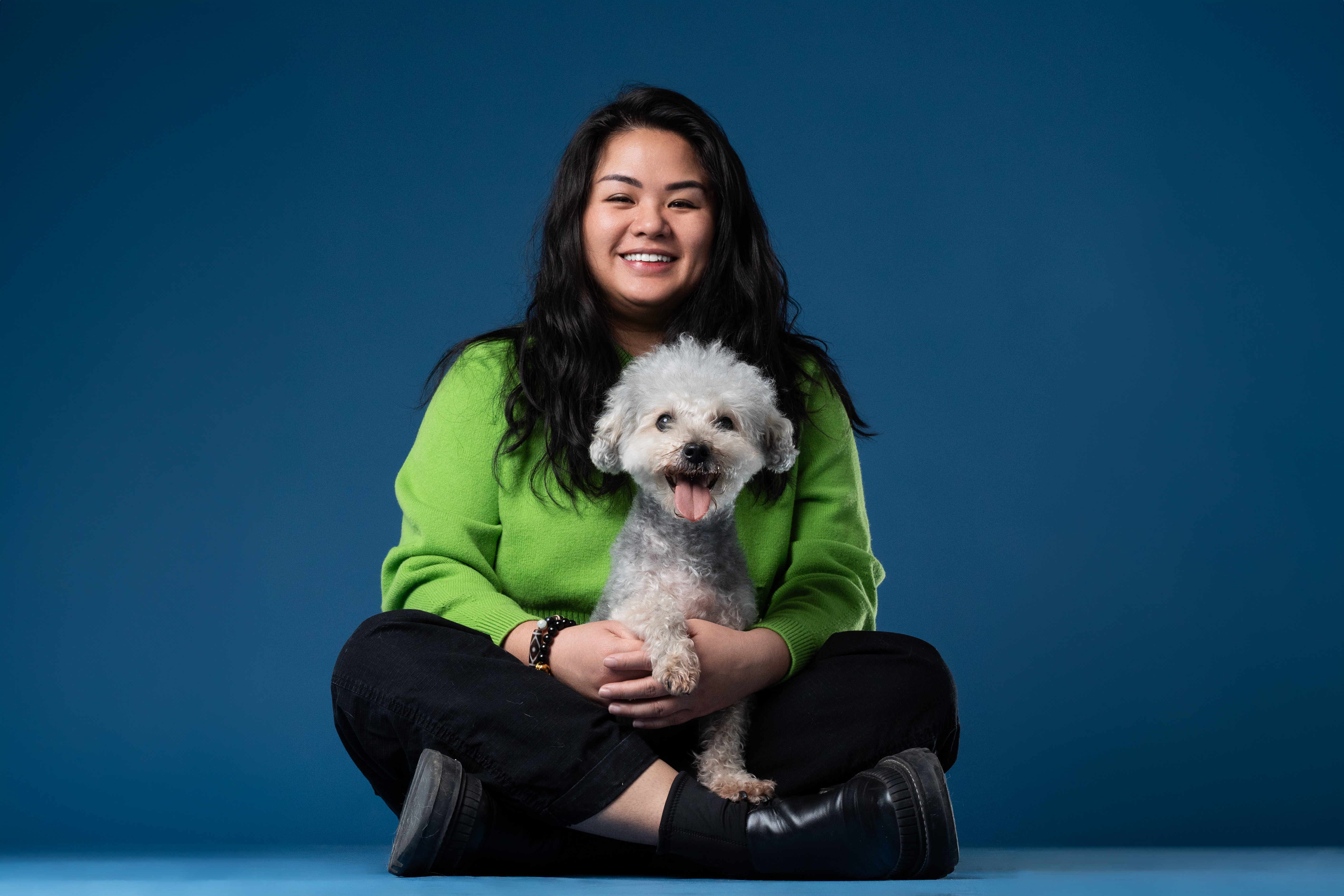 Lexy Khoo sitting with her dog